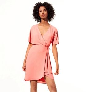 LIKE NEW Babaton Wallace wrap dress in Coral peach size med